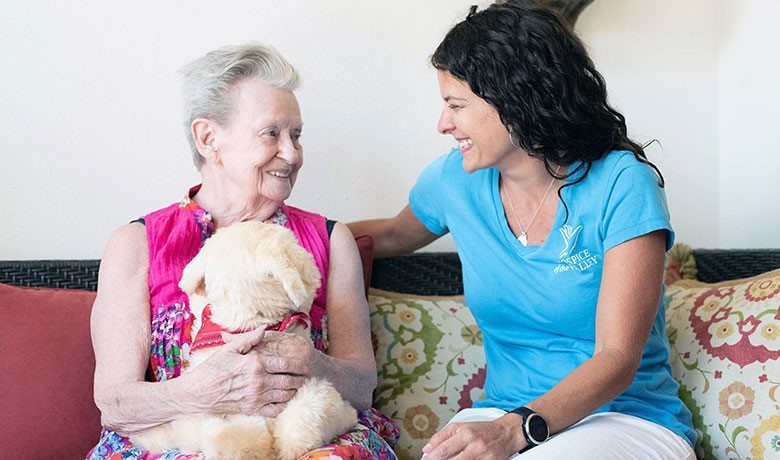 Michelle Bales with patient and mechanical pet