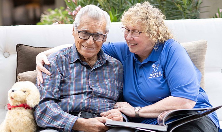 Dementia activities coordinator Gail Higginbotham, CNA, with patient Feliciano Ordonez.