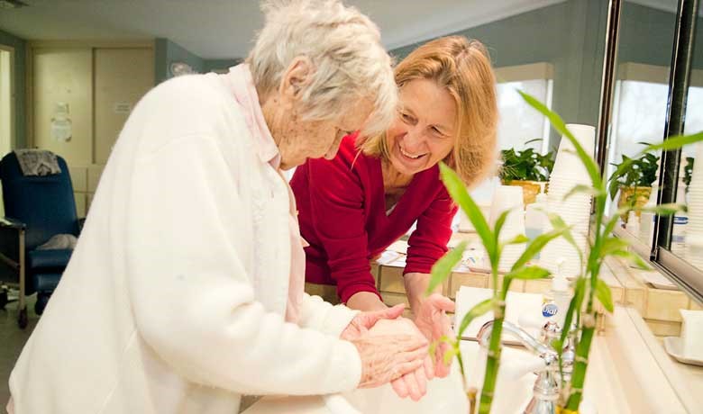 Gillian Hamilton talking with patient