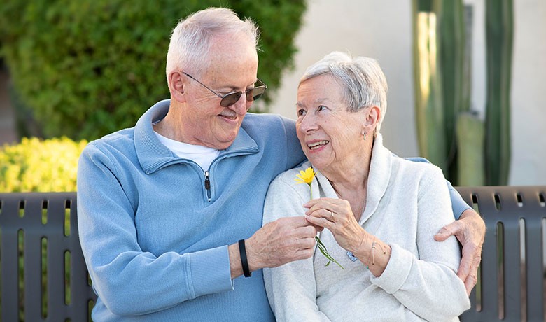 Couple hugging on a bench
