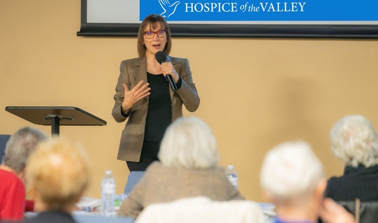 Maribeth Gallagher giving a lecture to a room of people