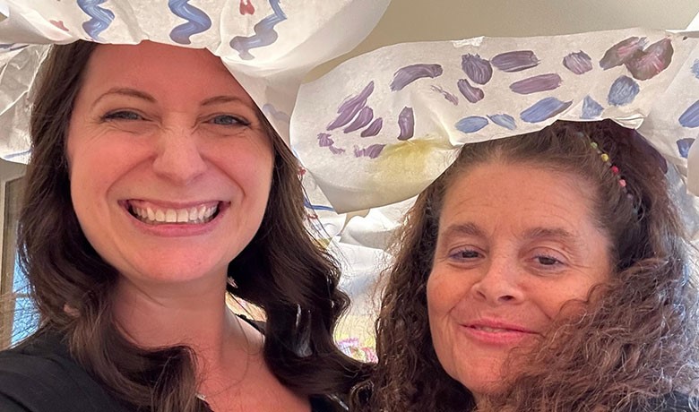 Sara Meins and Adult Day Club members wearing hats