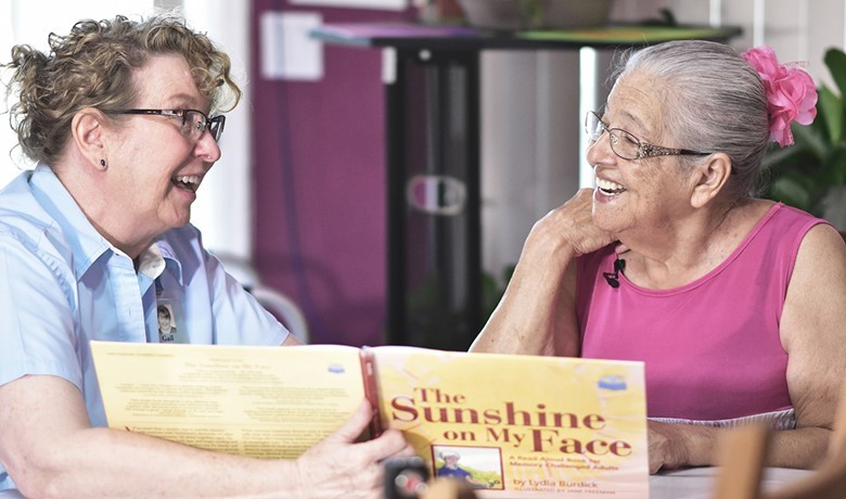 Dementia care educator Gail Higgenbotham connects with patient Tomasa.